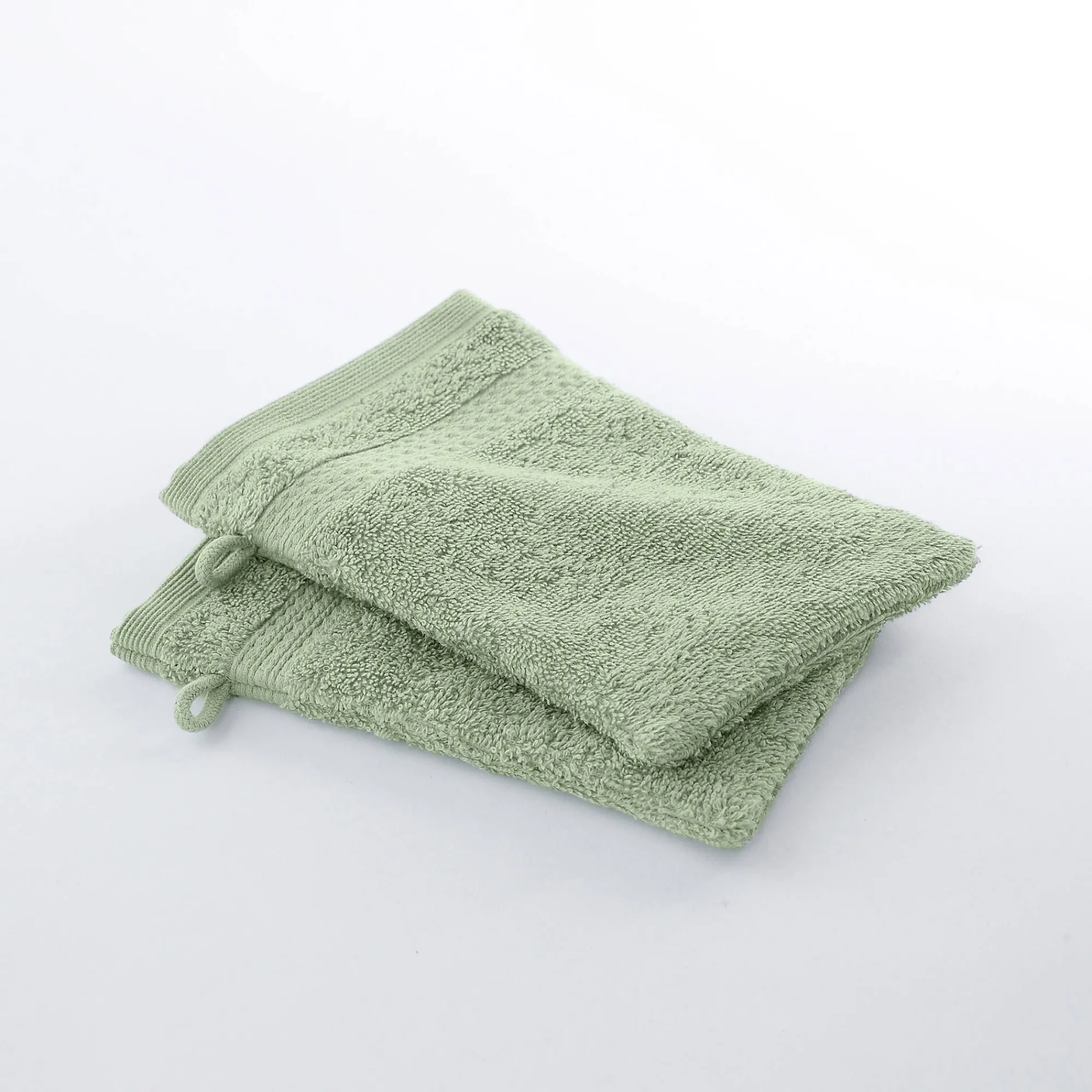 Badhanddoek<Colombine Badstof in katoen, afkomstig van de biologische landbouw lindegroen