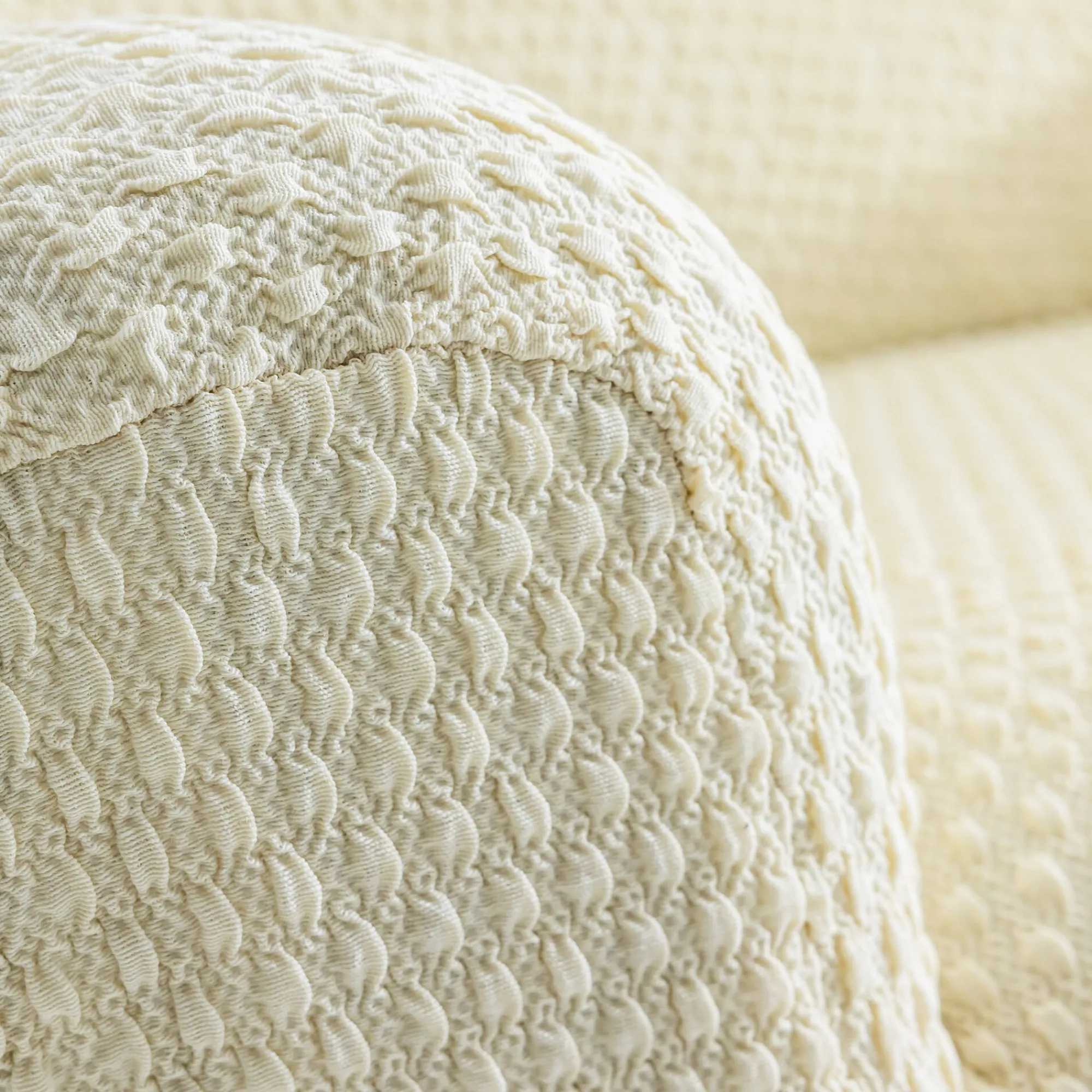 Zitbankhoes<Blancheporte Gewafelde, bi-rekbare hoes voor zitbank en fauteuil met armleuningen beige