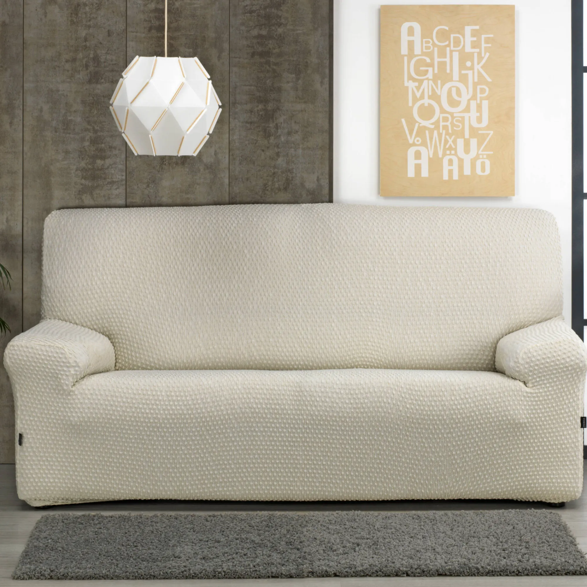 Zitbankhoes<Blancheporte Gewafelde, bi-rekbare hoes voor zitbank en fauteuil met armleuningen beige