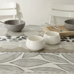 Tafelkleed<Blancheporte Tafellaken in toile cirée met bladeren- en tafellopereffect taupe / wit