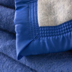 Deken<Ourson Tweekleurig deken in wol 800g/m2 blauw